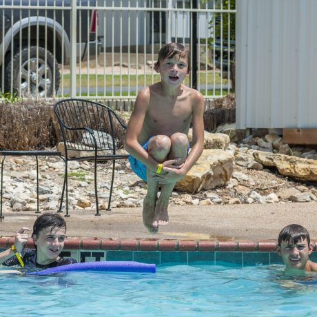Kid Jumping in Pool Image