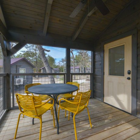 Howdy Cabin porch at Great Escapes RV Resorts Bryan College Station