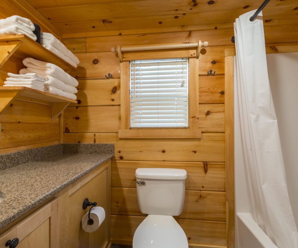 bathroom of Hullabaloo cabin rental at Great Escapes RV Resorts Bryan-College Station