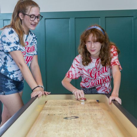 girls playing shuffleboard at Great Escapes RV Resorts Bryan College Station